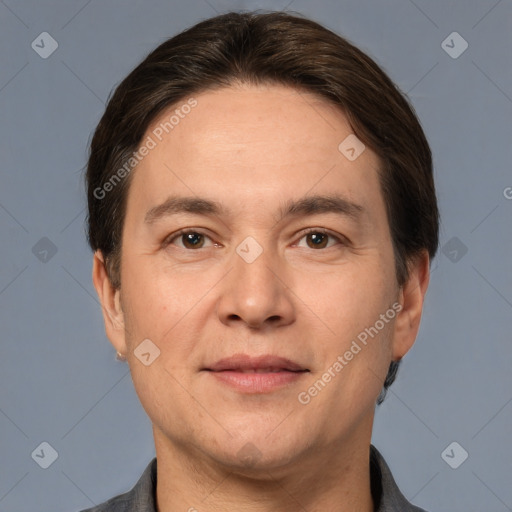 Joyful white adult male with short  brown hair and brown eyes