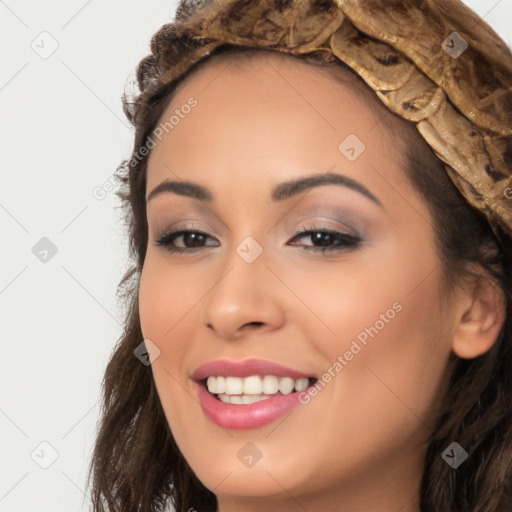 Joyful white young-adult female with long  brown hair and brown eyes