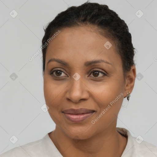 Joyful black adult female with short  brown hair and brown eyes