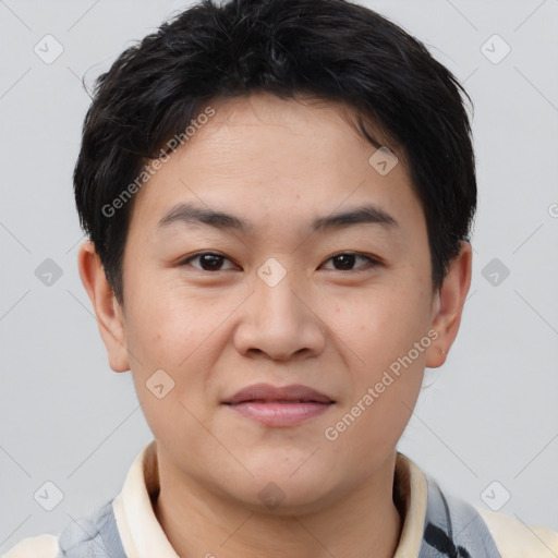 Joyful asian young-adult male with short  brown hair and brown eyes