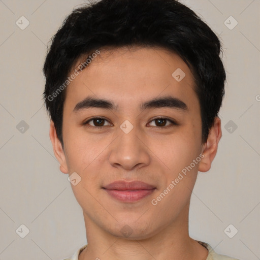 Joyful asian young-adult male with short  black hair and brown eyes