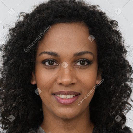 Joyful black young-adult female with long  brown hair and brown eyes