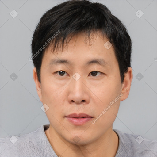 Neutral asian young-adult male with short  black hair and brown eyes