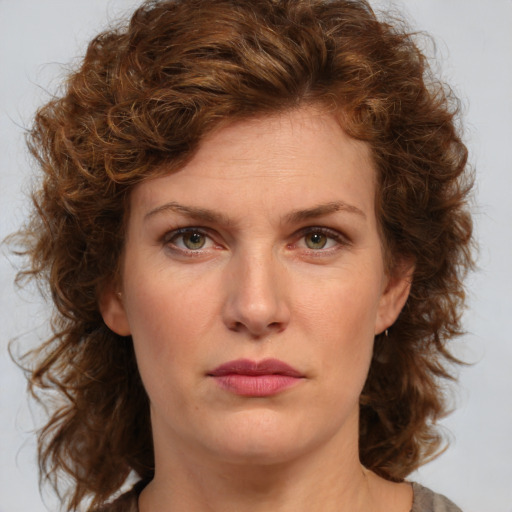 Neutral white young-adult female with medium  brown hair and green eyes