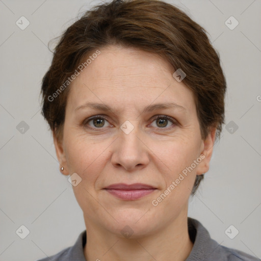 Joyful white adult female with short  brown hair and grey eyes