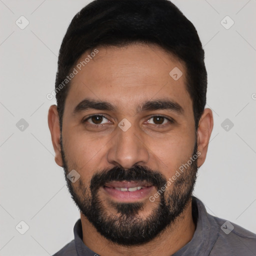 Joyful latino young-adult male with short  black hair and brown eyes