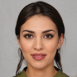 Joyful white young-adult female with medium  brown hair and brown eyes