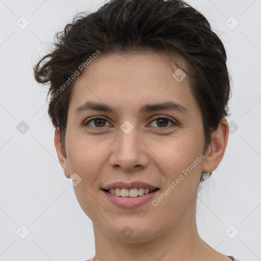 Joyful white young-adult female with short  brown hair and brown eyes