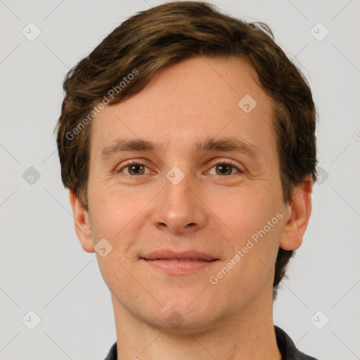 Joyful white young-adult male with short  brown hair and brown eyes