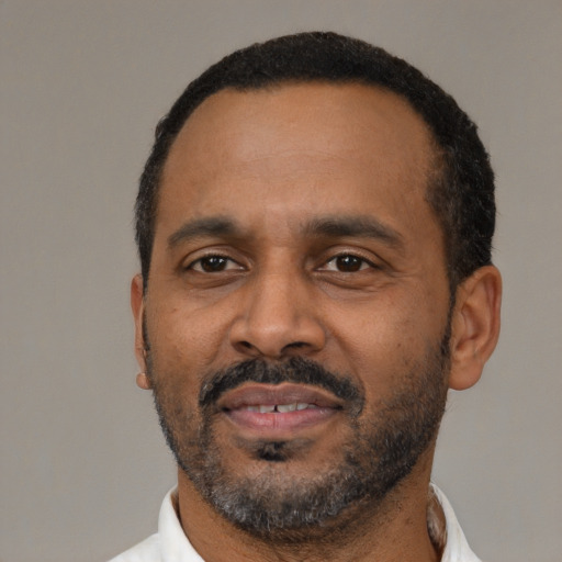 Neutral black adult male with short  black hair and brown eyes
