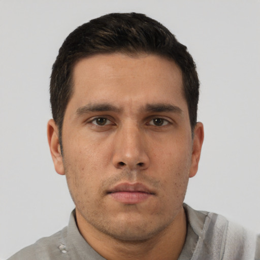 Neutral white young-adult male with short  black hair and brown eyes