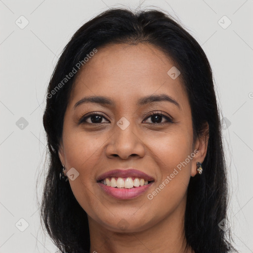 Joyful latino young-adult female with long  brown hair and brown eyes