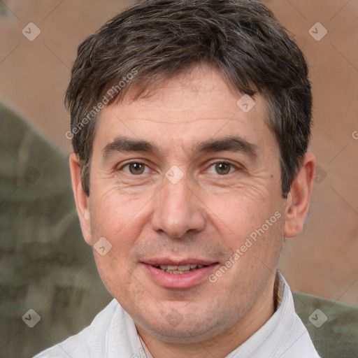 Joyful white adult male with short  brown hair and brown eyes