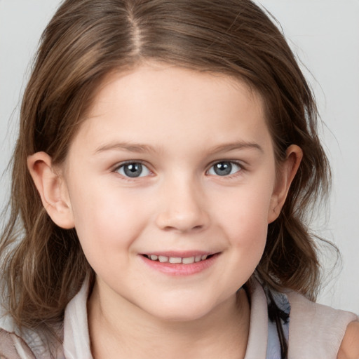 Joyful white child female with medium  brown hair and brown eyes