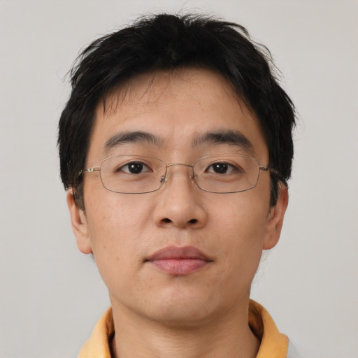 Neutral asian adult male with short  brown hair and brown eyes