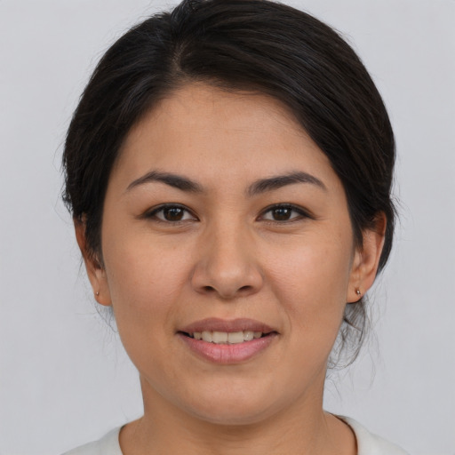 Joyful asian young-adult female with medium  brown hair and brown eyes