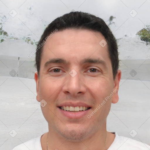 Joyful white adult male with short  brown hair and brown eyes