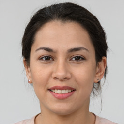 Joyful asian young-adult female with medium  brown hair and brown eyes