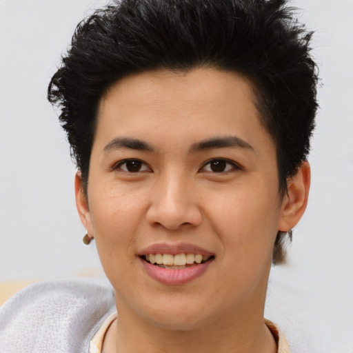 Joyful asian young-adult female with short  brown hair and brown eyes