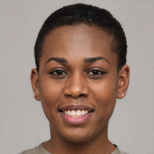 Joyful black young-adult female with short  black hair and brown eyes