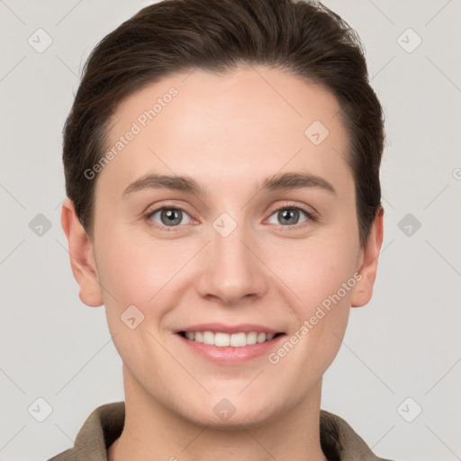 Joyful white young-adult female with short  brown hair and grey eyes