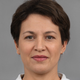 Joyful white adult female with short  brown hair and brown eyes