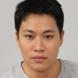 Neutral asian young-adult male with short  black hair and brown eyes