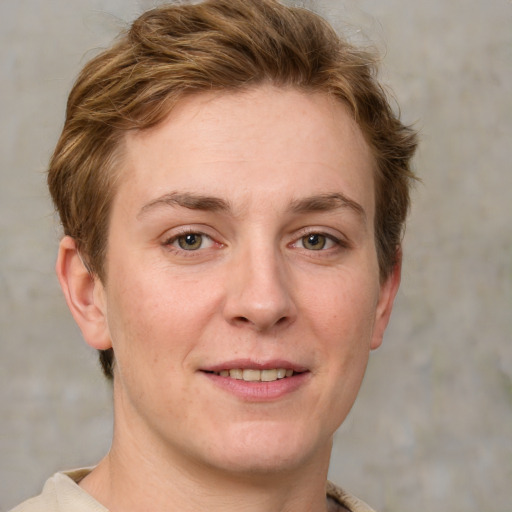 Joyful white young-adult female with short  brown hair and grey eyes