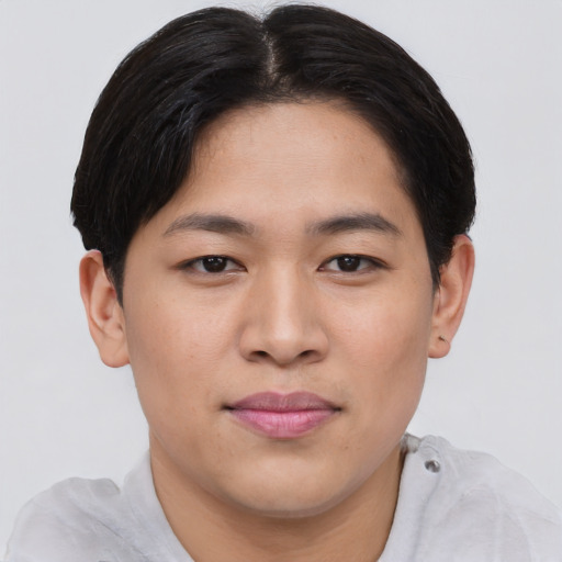 Joyful asian young-adult male with short  brown hair and brown eyes