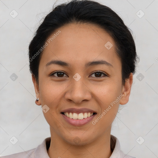 Joyful latino young-adult female with short  brown hair and brown eyes