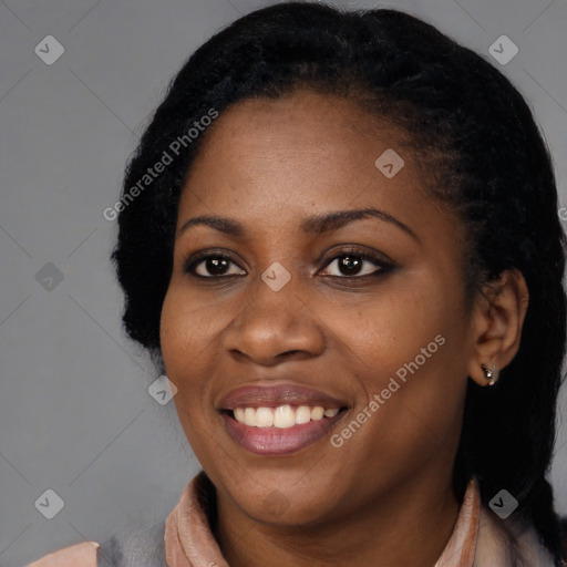 Joyful black young-adult female with long  black hair and brown eyes