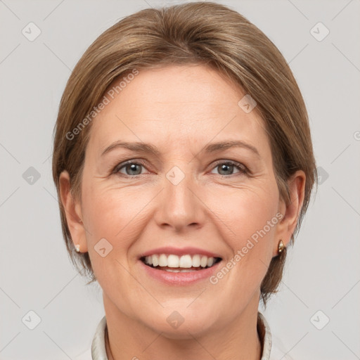 Joyful white adult female with medium  brown hair and grey eyes