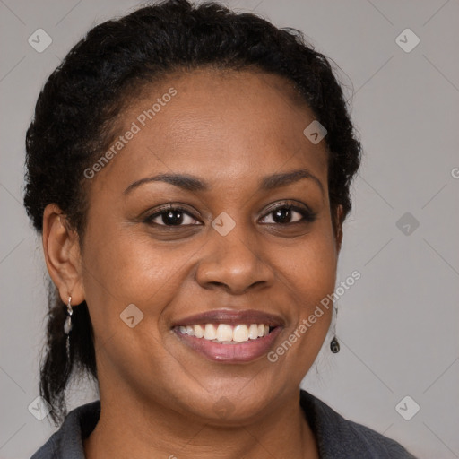 Joyful black young-adult female with medium  brown hair and brown eyes