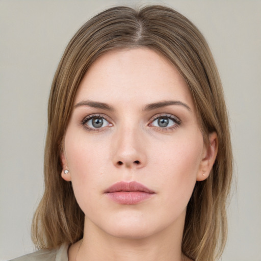 Neutral white young-adult female with long  brown hair and green eyes