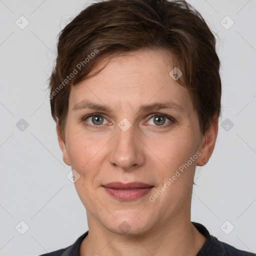 Joyful white adult female with short  brown hair and grey eyes