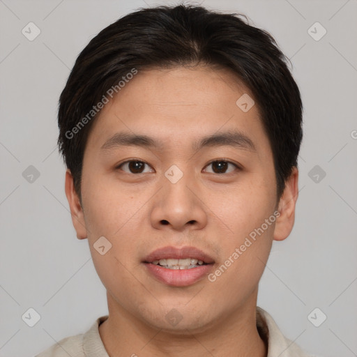 Joyful asian young-adult male with short  brown hair and brown eyes