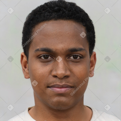 Joyful black young-adult male with short  brown hair and brown eyes