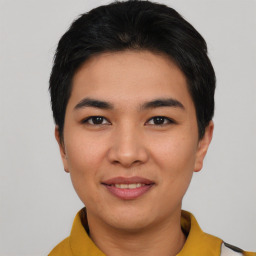 Joyful asian young-adult male with short  black hair and brown eyes