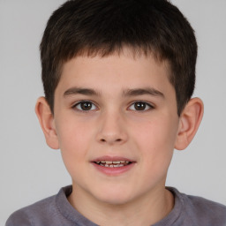 Joyful white child male with short  brown hair and brown eyes