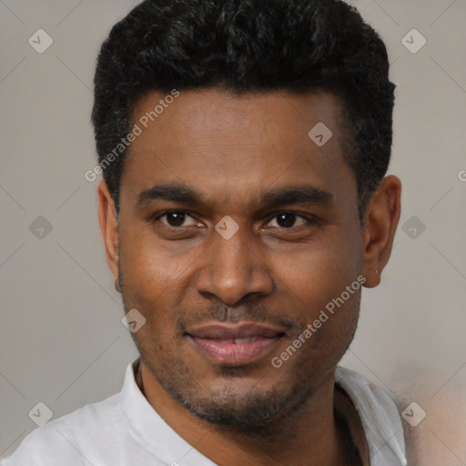 Joyful black young-adult male with short  black hair and brown eyes