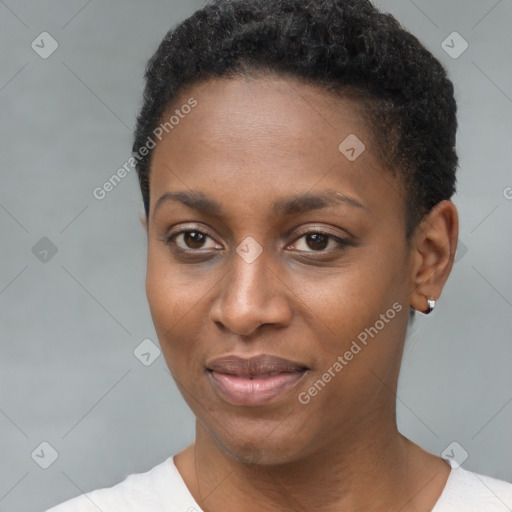 Joyful black young-adult female with short  black hair and brown eyes