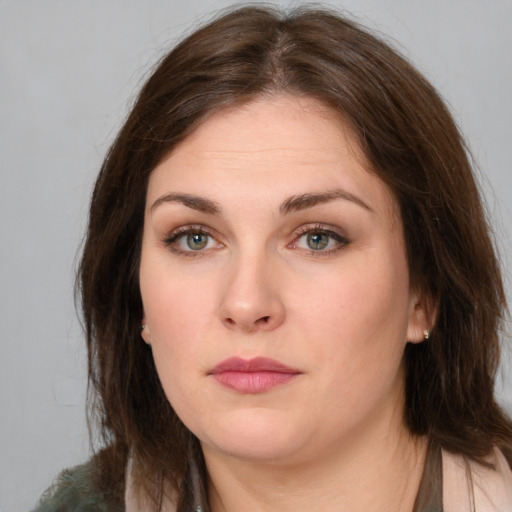 Neutral white young-adult female with medium  brown hair and green eyes