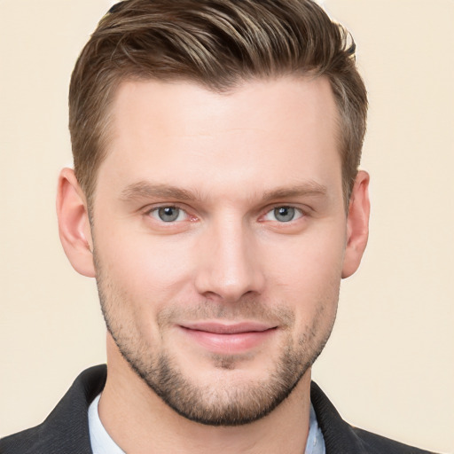 Joyful white young-adult male with short  brown hair and grey eyes