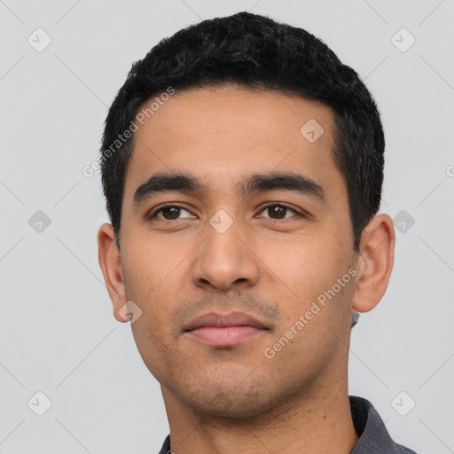 Neutral latino young-adult male with short  black hair and brown eyes