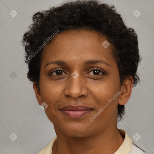 Joyful black adult female with short  brown hair and brown eyes