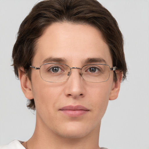 Joyful white adult male with short  brown hair and grey eyes