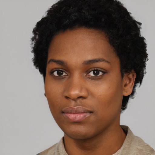 Neutral black young-adult female with short  black hair and brown eyes