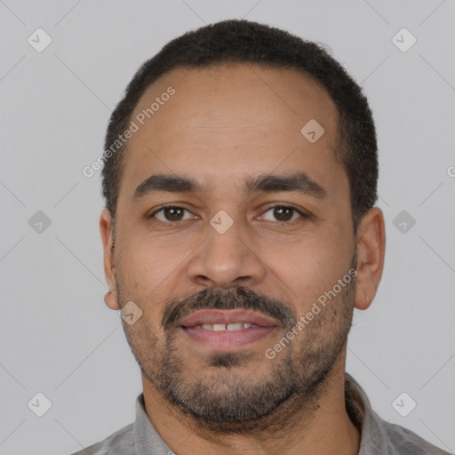 Joyful latino adult male with short  black hair and brown eyes