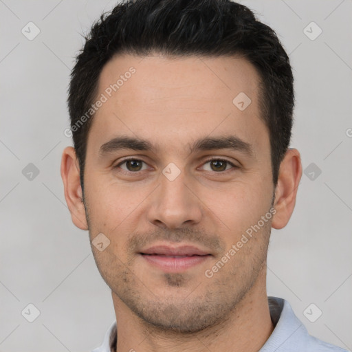 Joyful white young-adult male with short  black hair and brown eyes