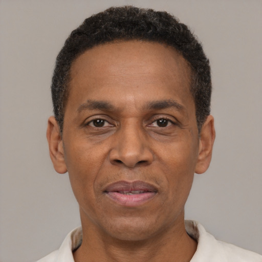 Joyful latino adult male with short  black hair and brown eyes